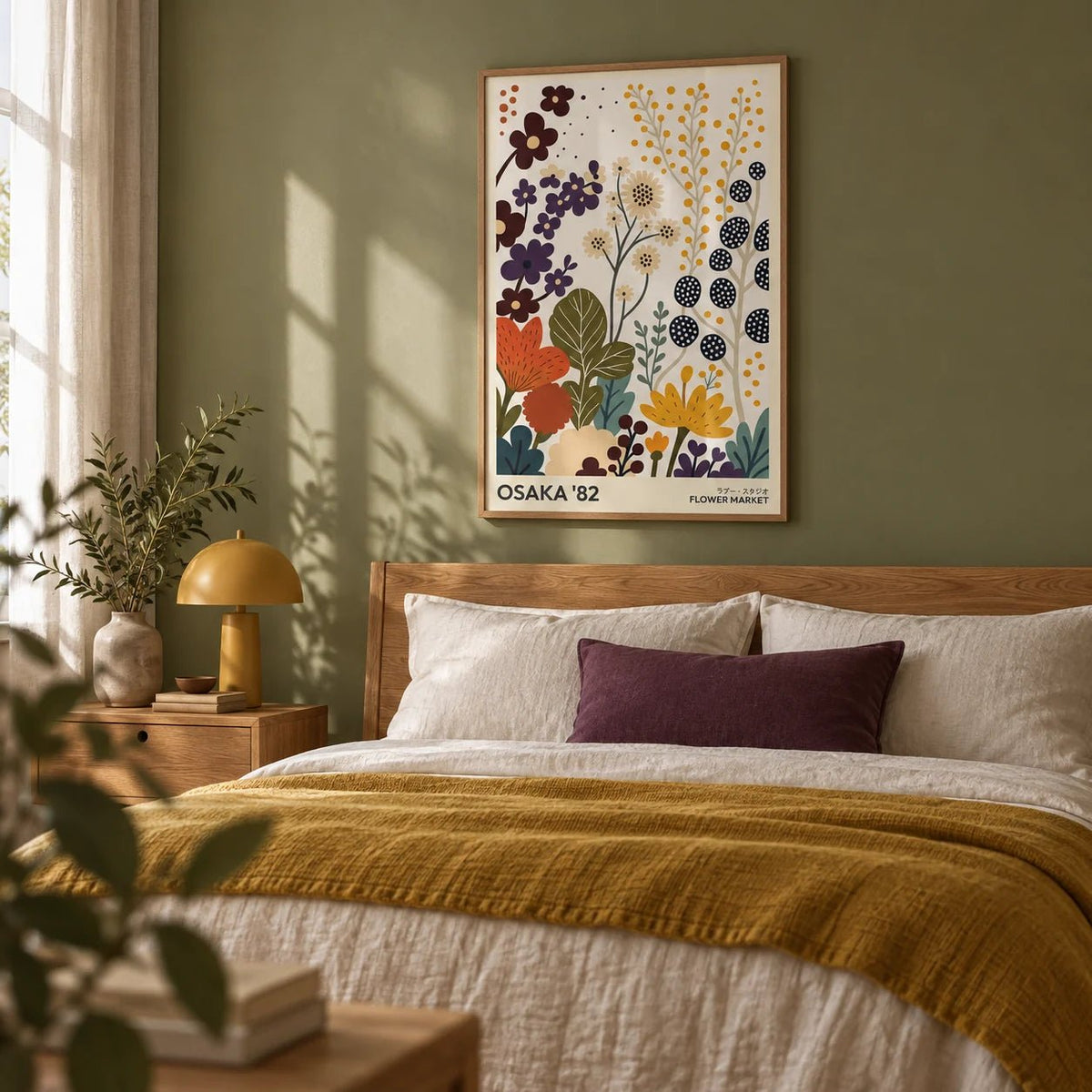Flower Prints Art, framed on the wall of a calm bedroom with a soft olive green painted wall