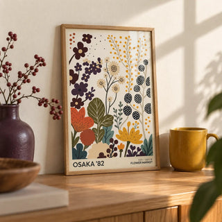 Flower Prints Art, a small A4 framed print leaning on an oak shelf in a living room
