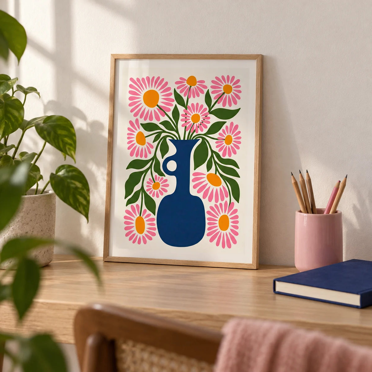 Flower Vase Print, a small A4 framed print leaning on a pale oak desk