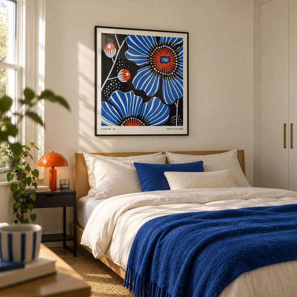Flowers Prints, framed on the wall of a crisp modern bedroom in a young couple's UK flat with an ivory wall