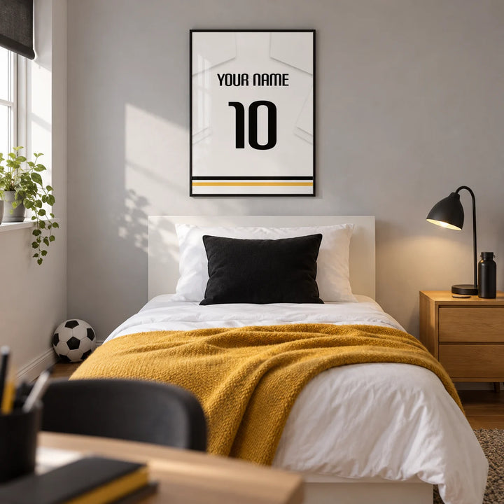 Football Shirt Poster in All White with Black Number, framed on the wall of a modern football-loving teenager's single bedroom (13-17) in a UK family home with a pale grey wall and oak floor
