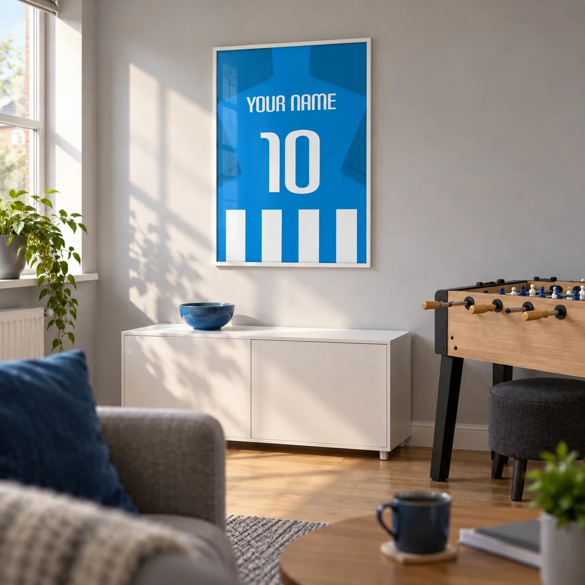 Football Shirt Poster in Blue and White Stripes with Blue Sleeves, framed on the wall of a football fan's games snug in a UK semi-detached home with a pale grey wall and oak floor in a living room