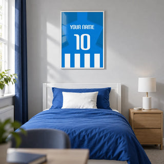 Football Shirt Poster in Blue and White Stripes with Blue Sleeves, framed on the wall of a modern teenage football fan's single bedroom (13-17) in a UK family home with a pale grey wall