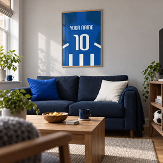 Football Shirt Poster in Blue and White Stripes with White Number, framed on the wall of a contemporary football-watching snug in a UK terrace with a pale grey wall and low walnut furniture in a living room