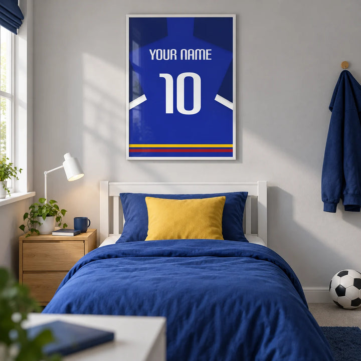 Football Shirt Poster in Blue with White Sleeve Stripe, framed on the wall of a modern football-loving teenager's single bedroom (13-17) in a UK family home with a pale grey wall