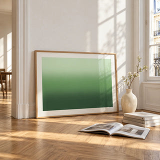 Forest Green Wall Art, framed and leaning on the parquet floor of a bright living room