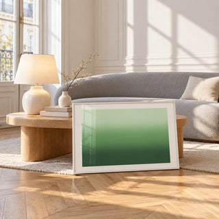 Forest Green Wall Art, framed and leaning against a coffee table in a bright living room