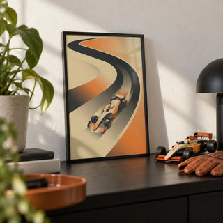 Formula Racing Art Print, a small A4 framed print leaning on a black shelf in a living room