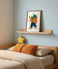 Bedroom with wooden bed, orange pillows, and a framed illustration of a frog playing the trumpet.