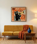 Living room with a mustard yellow sofa, blue vase, and framed jazz-themed poster on the wall.