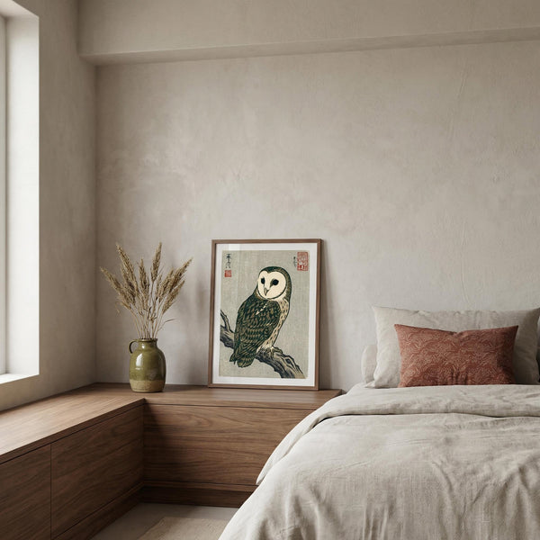Bedroom with a framed owl print on a wall above a wooden shelf.