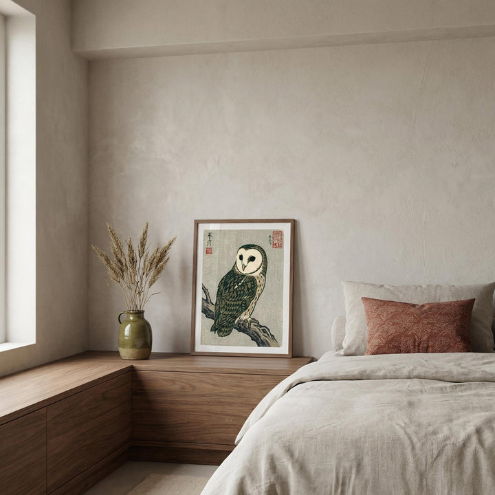 Bedroom with a framed owl print on a wall above a wooden shelf.