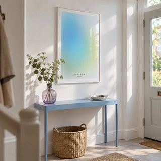 Freedom Poster, framed on the wall of a bright entrance hallway in a UK flat with white walls and a pale grey stone floor