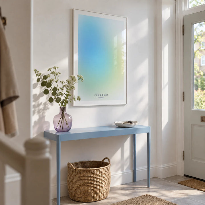 Freedom Poster, framed on the wall of a bright entrance hallway in a UK flat with white walls and a pale grey stone floor