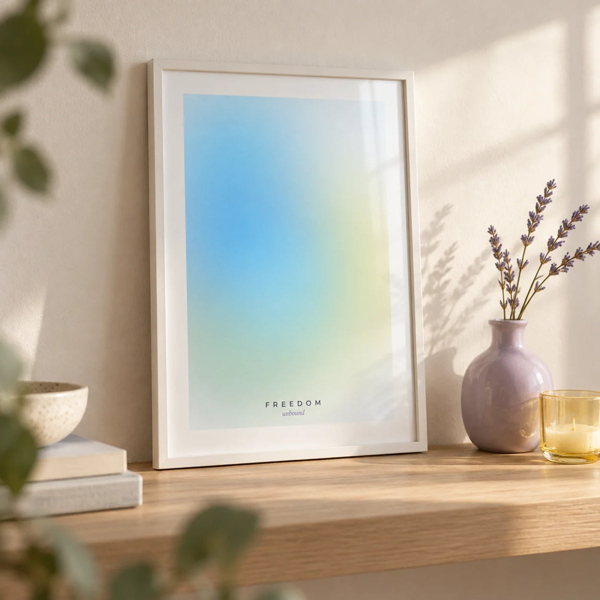 Freedom Poster, a small A4 framed print leaning on a pale oak shelf in a living room