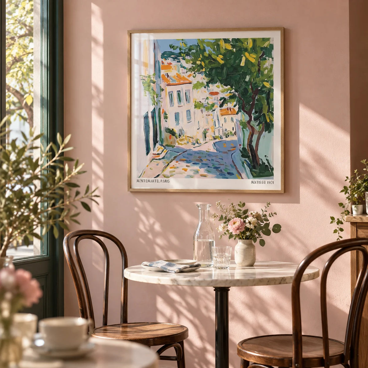 French Artwork Prints, framed on the wall of a bistro-style dining corner with a soft blush pink wall