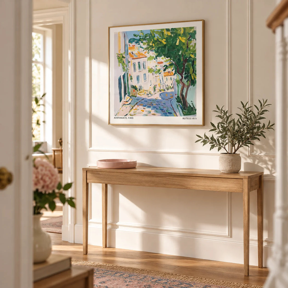 French Artwork Prints, framed on the wall of a bright hallway with a warm white panelled wall