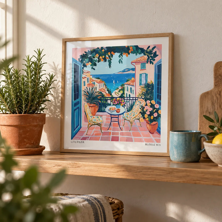 French Coastal Wall Art, a small A4 framed print leaning on an oak shelf in a living room