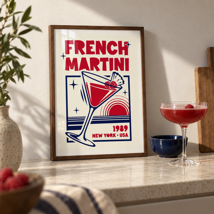 French Martini Poster, a small A4 framed print leaning on a pale stone kitchen worktop