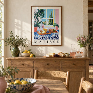 French Prints, framed on the wall of a relaxed French country dining room with a limewashed cream wall
