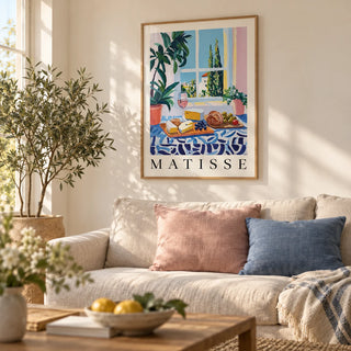 French Prints, framed on the wall of a relaxed living room with a warm white wall