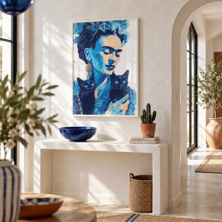 Wall Art Frida Kahlo, framed on the wall of a bright hallway with a white limewashed wall and an arched niche