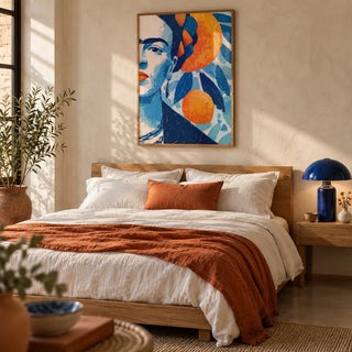 Frida Kahlo Gifts, framed on the wall of a calm Mexican-modern bedroom with a soft cream plaster wall