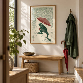 Frog In Rain Art Print, framed on the wall of a bright hallway
