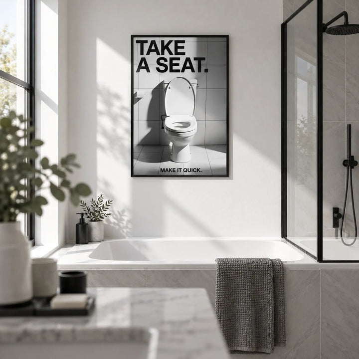 Funny Bathroom Art, framed on the wall of a crisp monochrome family bathroom