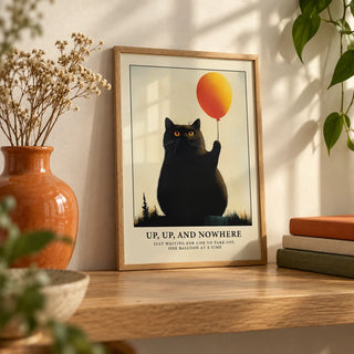 Funny Cat Poster, a small A4 framed print leaning on an oak shelf in a living room