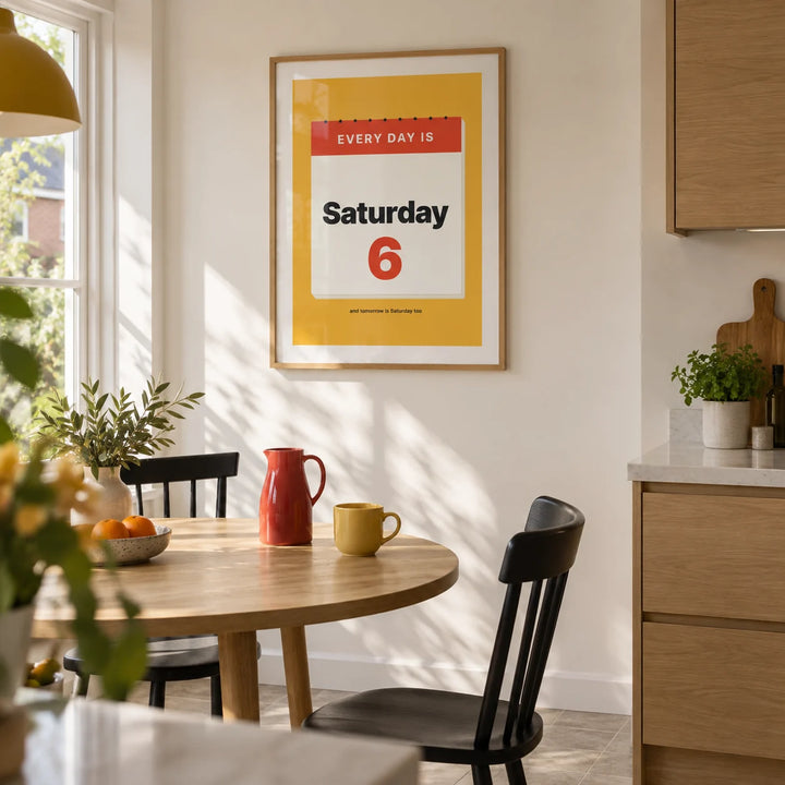 Funny Retirement Poster, framed on the wall of a bright contemporary kitchen in a UK semi-detached home with off-white walls and flat-front oak cabinets
