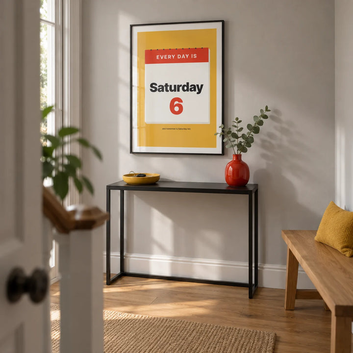Funny Retirement Poster, framed on the wall of a crisp entrance hallway in a renovated UK terraced house with pale grey walls and an oak floor