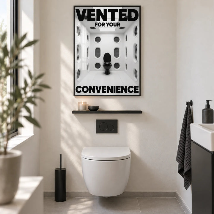 Funny Toilet Sign, framed on the wall of a design-led guest WC with a plain warm white wall and a pale grey floor