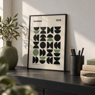 Gallery Print, a small A4 framed print leaning on a black shelf in a living room