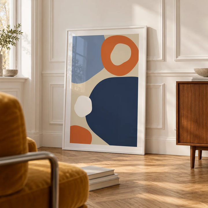 Geometric Abstract Art, framed on the wall of a bright room with white panelled walls and a herringbone floor in a living room