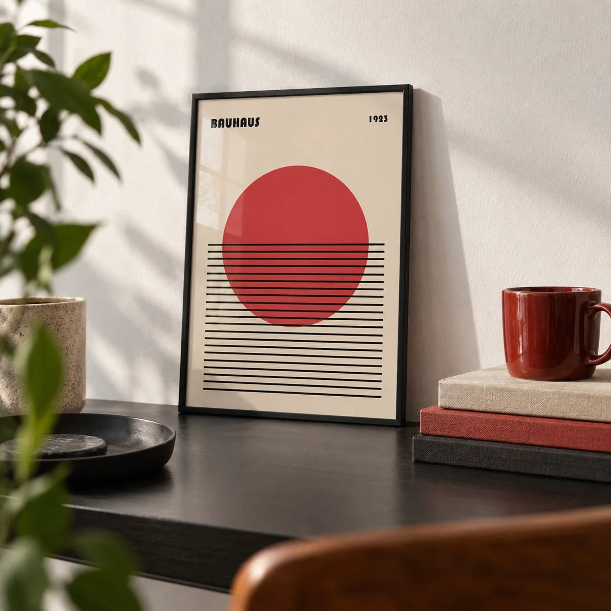 Geometric Art Print, a small A4 framed print leaning on a black desk
