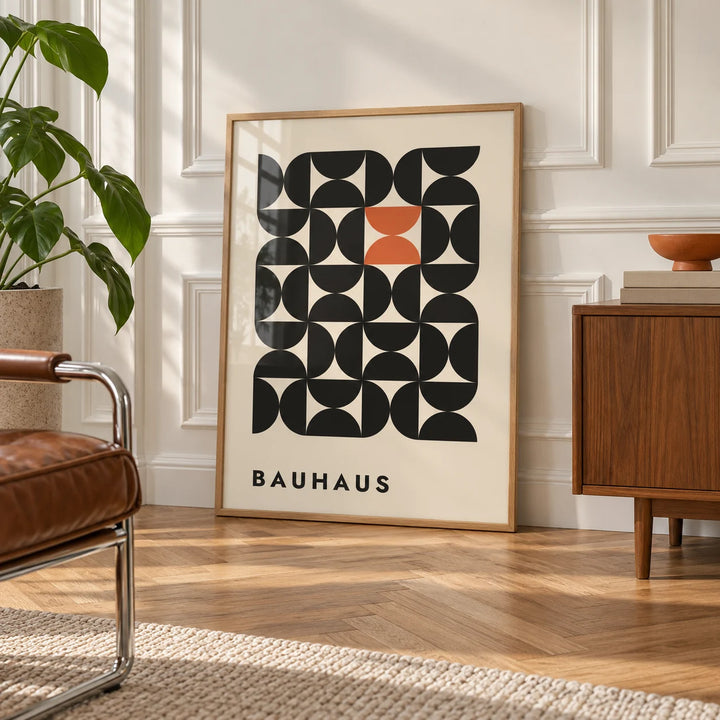 Geometric Bauhaus Art, framed on the wall of an elegant room with white panelled walls with classic mouldings and a herringbone oak floor in soft side light