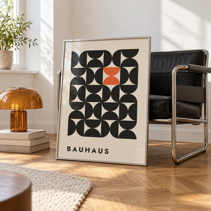 Geometric Bauhaus Art, framed on the wall of a white room corner with soft daylight and herringbone oak parquet in a living room