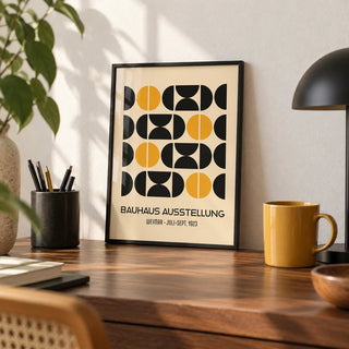 Geometric Bauhaus Poster, a small A4 framed print leaning on a walnut desk