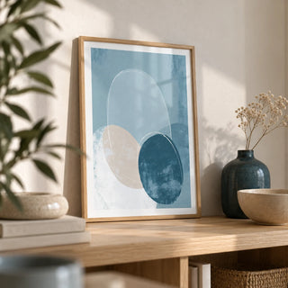 Geometric Circle Poster, a small A4 framed print leaning on a pale oak shelf in a living room