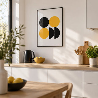 Geometric Posters, framed on the wall of a modern kitchen with white units and a white wall