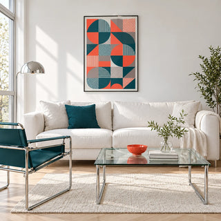 Geometric Prints, framed on the wall of a bright white living room with chrome furniture