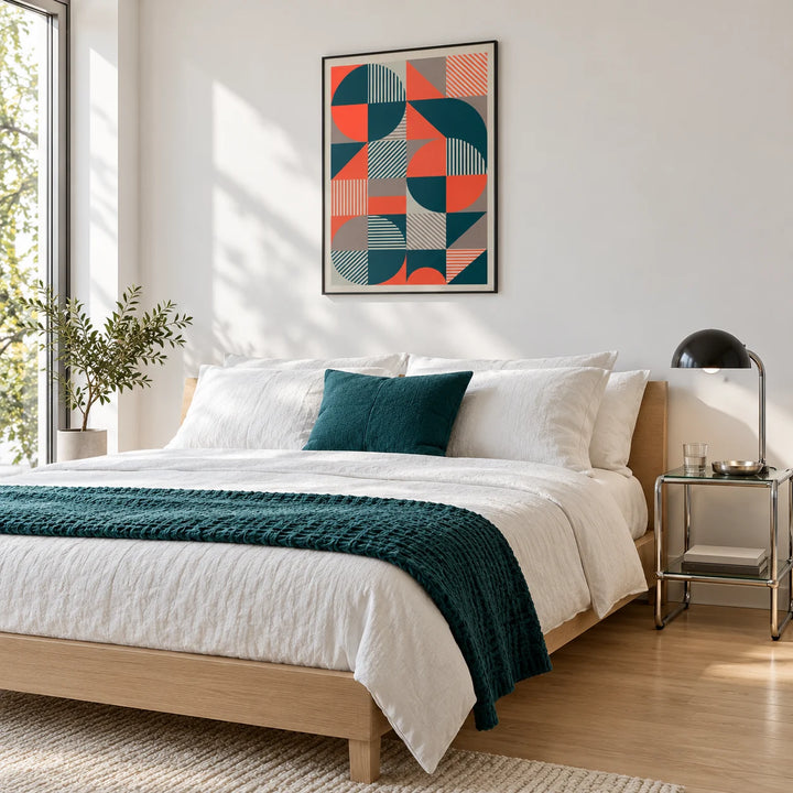 Geometric Prints, framed on the wall of a calm white bedroom