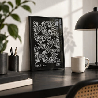 Geometric Wall Art, a small A4 framed print leaning on a black desk