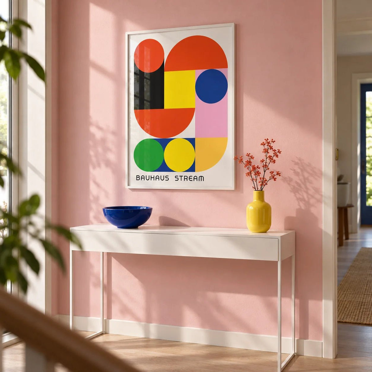Geometric Wall Decal, framed on the wall of a modern hallway with a soft pink painted wall