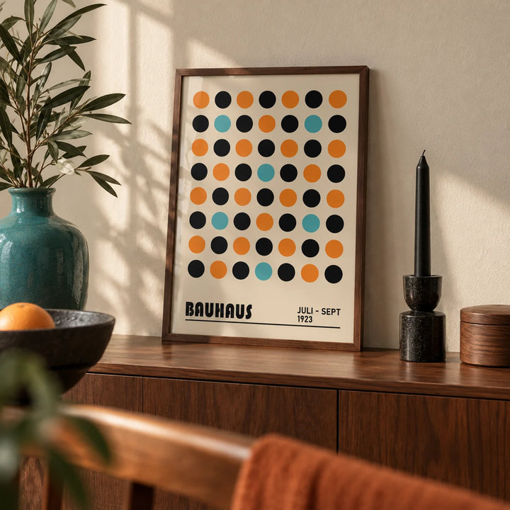 Geometric Wall Decor, a small A4 framed print leaning on a walnut sideboard in a living room