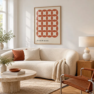 Geometric Wall Hanging, framed on the wall of a bright apartment living room with white walls and honey herringbone parquet