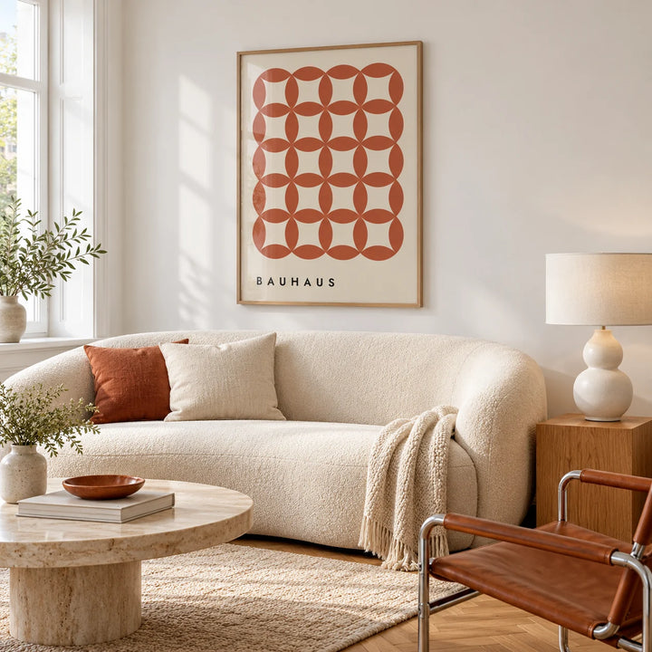 Geometric Wall Hanging, framed on the wall of a bright apartment living room with white walls and honey herringbone parquet