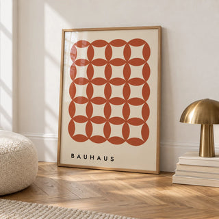 Geometric Wall Hanging, framed on the wall of a calm white room with a white skirting board and herringbone oak parquet