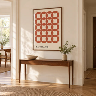 Geometric Wall Hanging, framed on the wall of a hallway with a warm white wall and herringbone oak floor